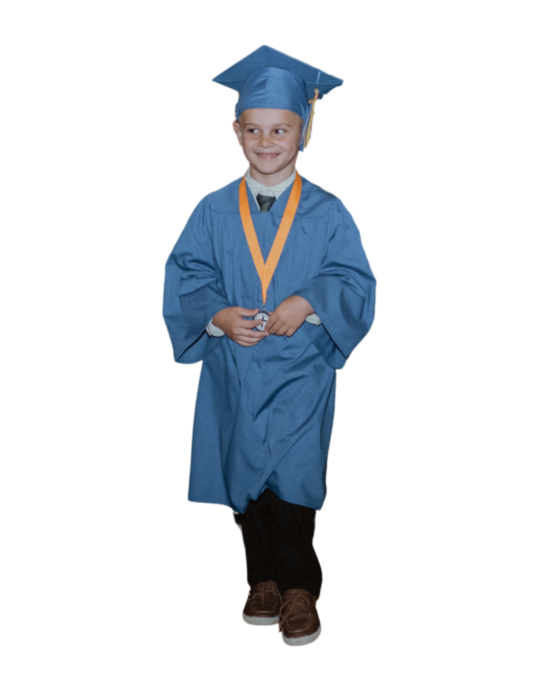 kindergartener graduating walking in cap and gown